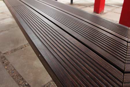 Closeup of dassoXTR fused bamboo decking used on bench
